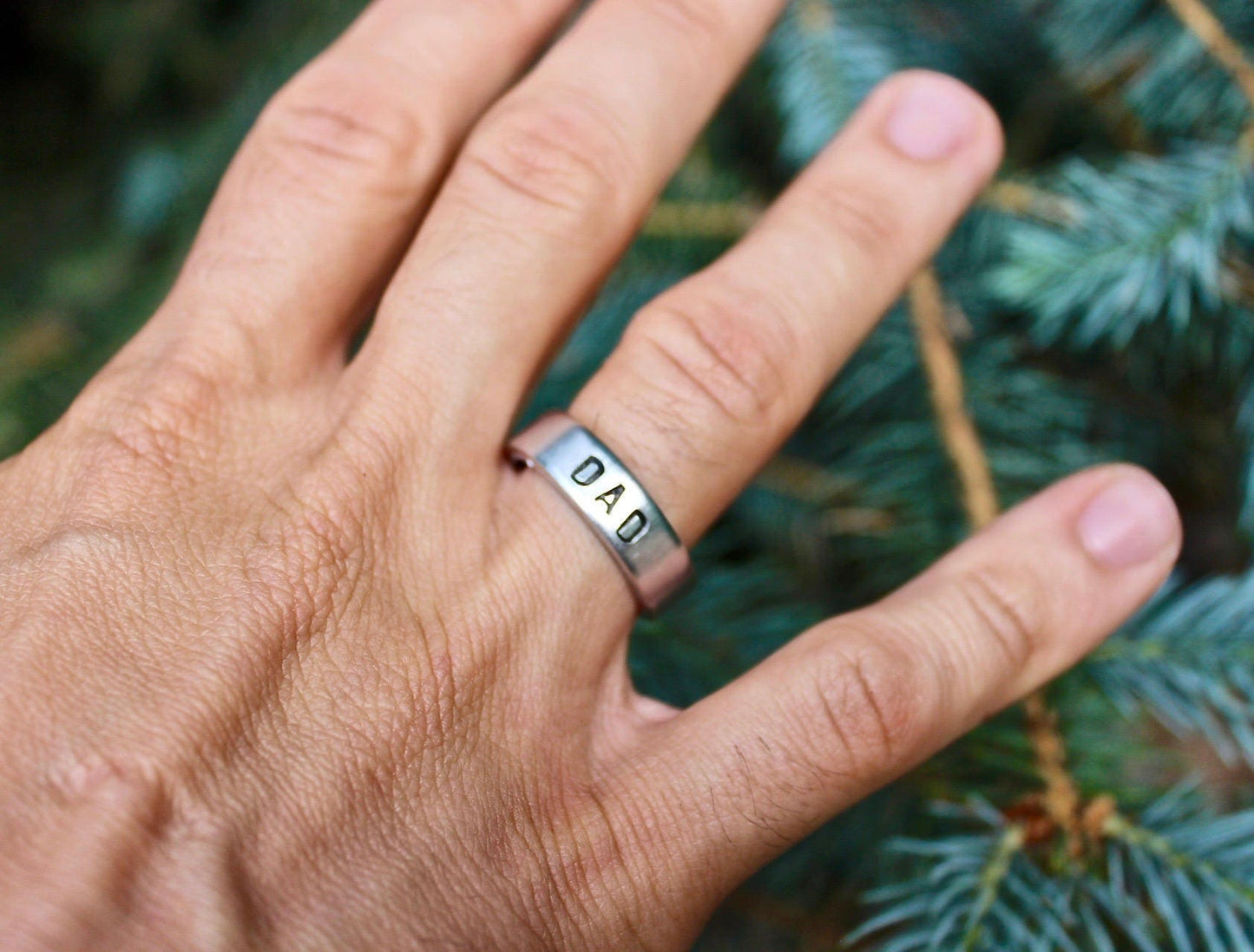 Aluminum, adjustable ring with “DAD” engraved