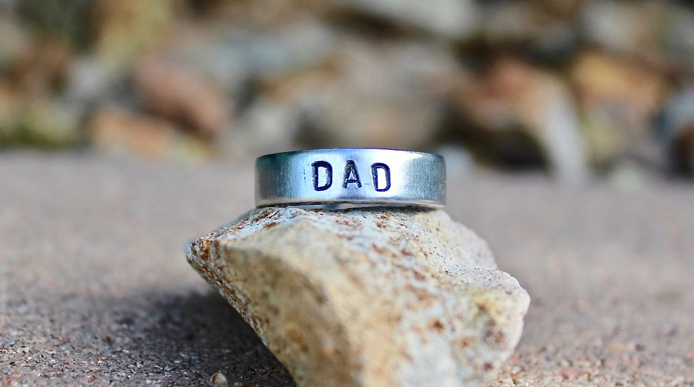 Aluminum, adjustable ring with “DAD” engraved
